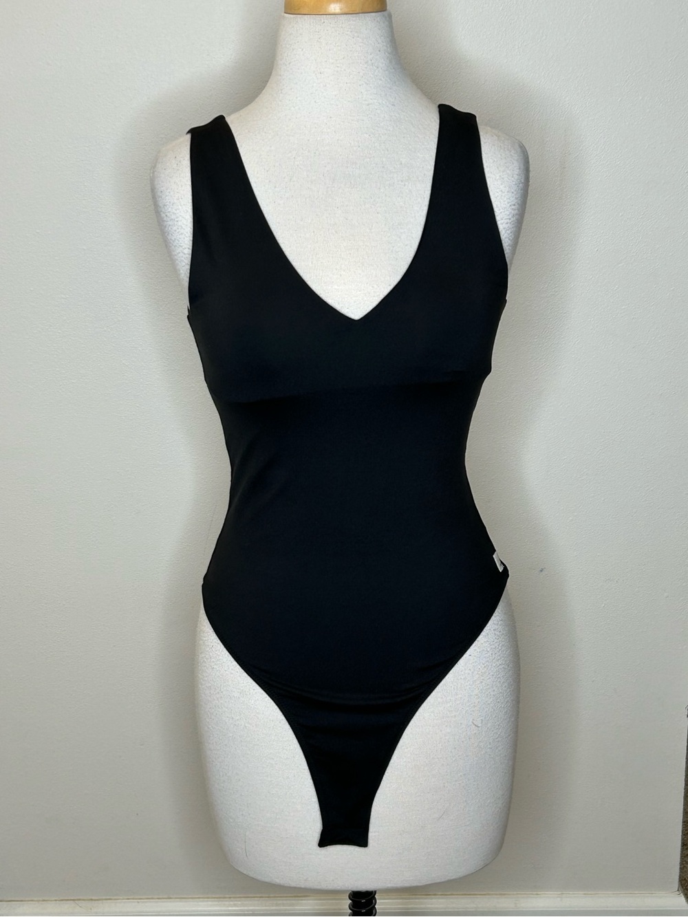 Vuori Black V-Neck One-Piece Bodysuit Size S Snap Crotch NWOT